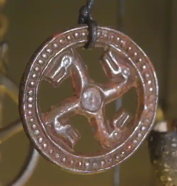 Swastika with animal head on the sides